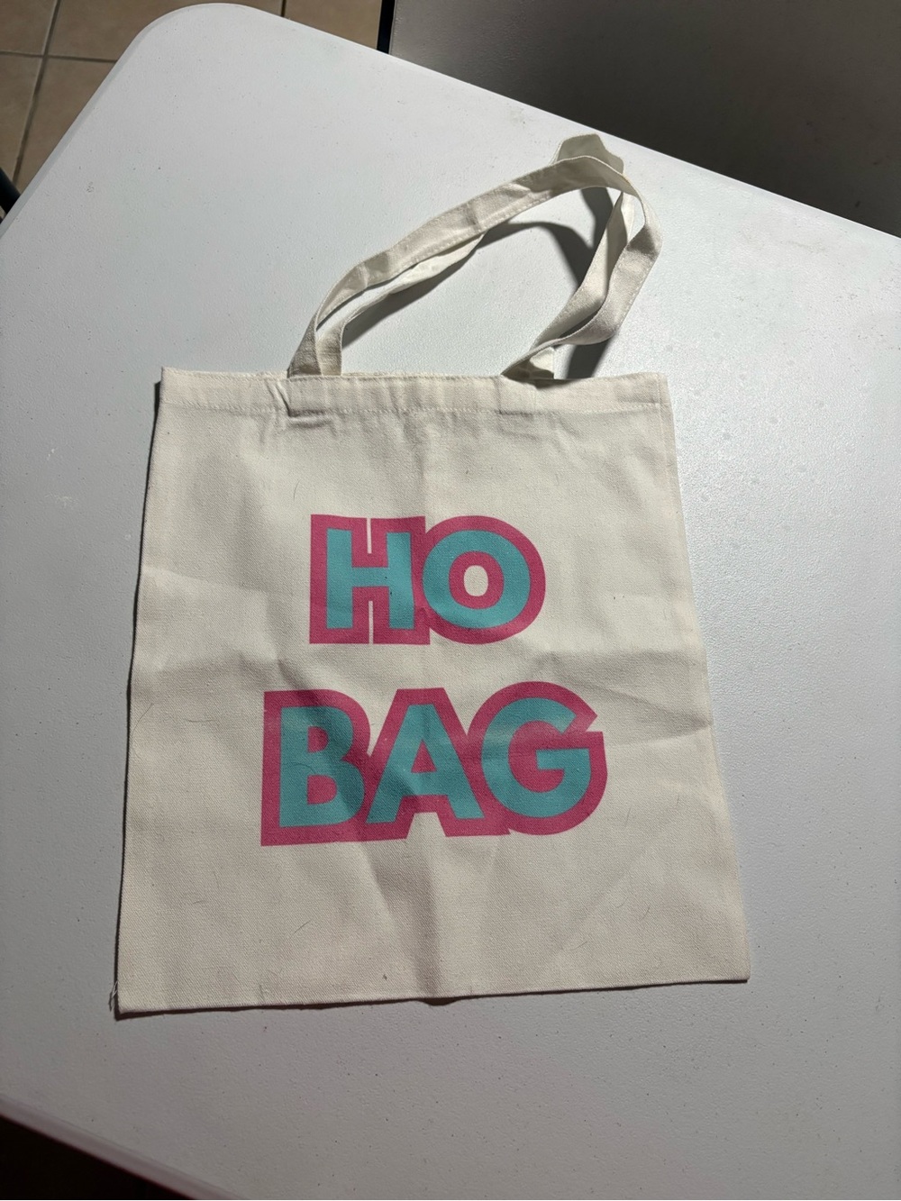 Cream Canvas Tote with Pink-Outlined Teal 'HO BAG' Print